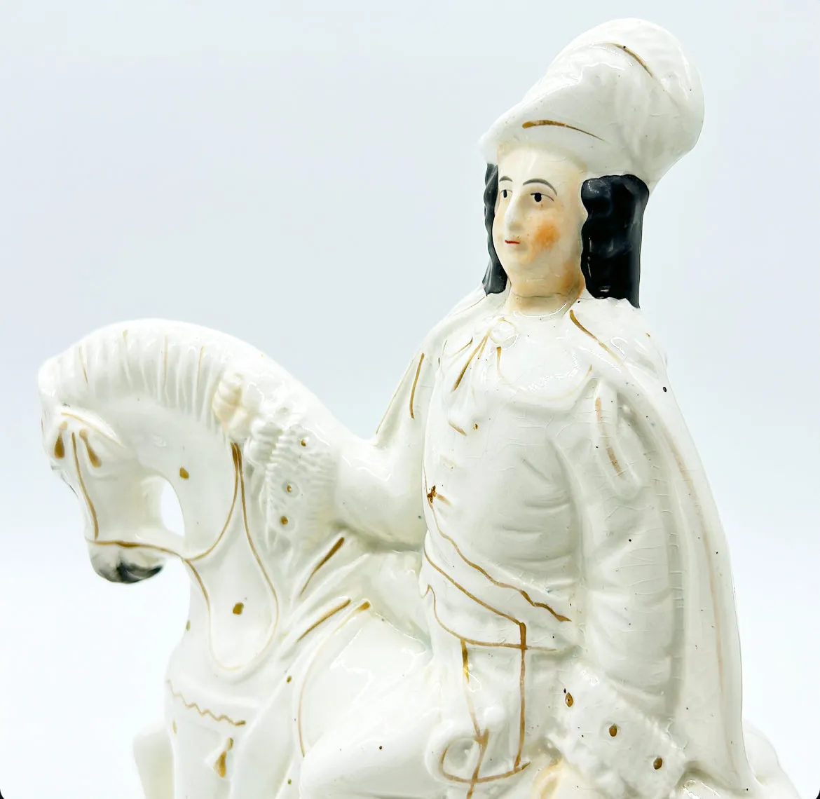 Classic antique English Staffordshire man on horse design.